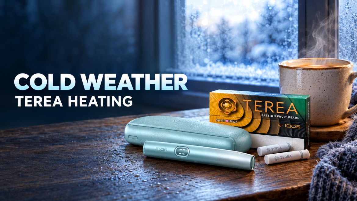 IQOS ILUMA device and TEREA sticks resting on a table next to a warm drink on a cold morning