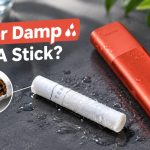 Home 54 Wet TEREA stick lying next to an IQOS ILUMA holder on a dry surface